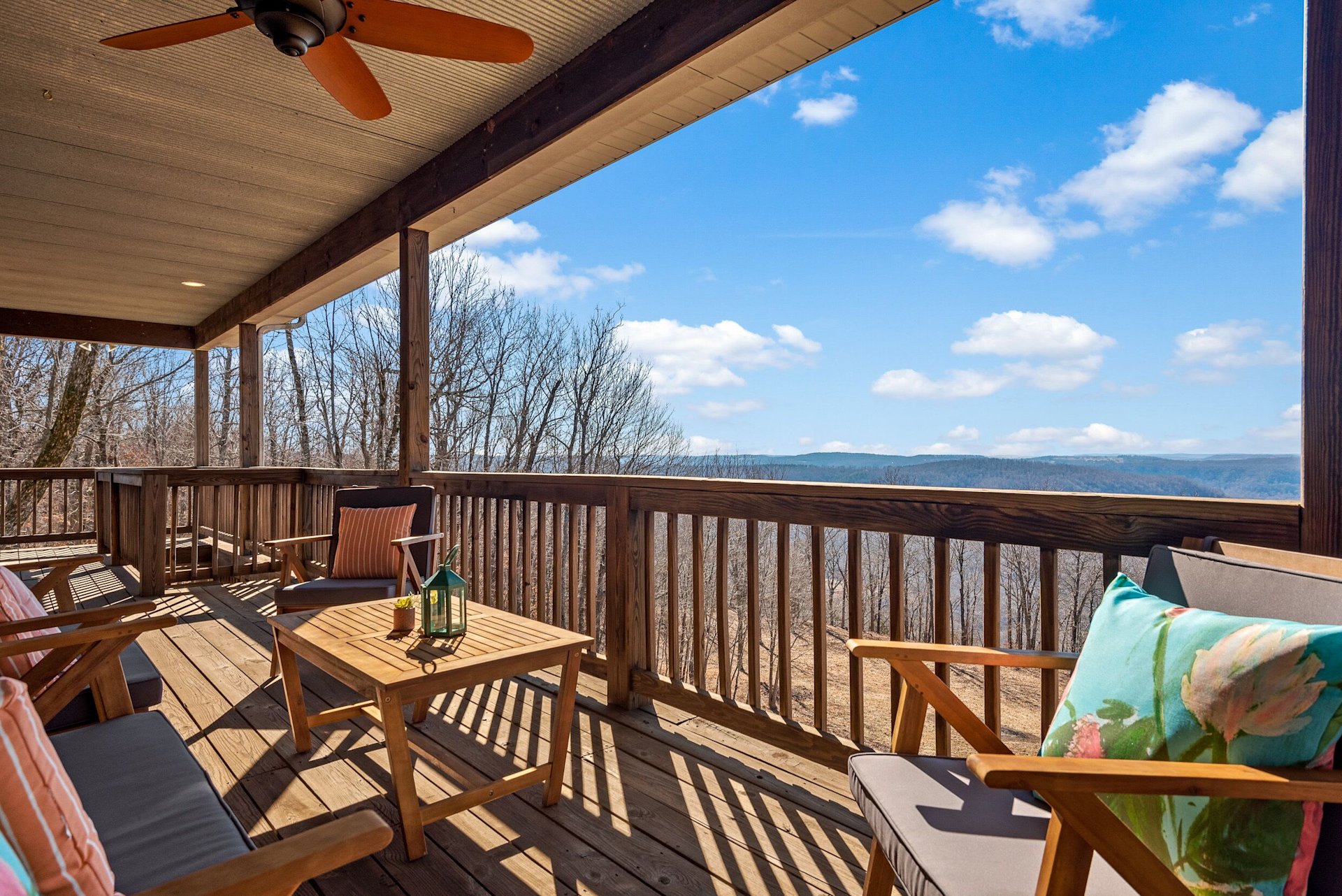 Covered deck with panoramic Ozark mountain views at Jasper Hideaway, a Weekender-managed cabin near Jasper, Arkansas