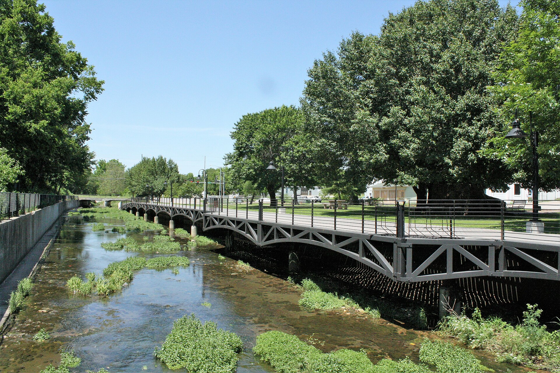 Spring Creek Boardwalk in downtown Springdale, Arkansas—the Northwest Arkansas Razorback Regional Greenway passes through downtown along Spring Creek. Airbnb and short-term rental management by Weekender Management.